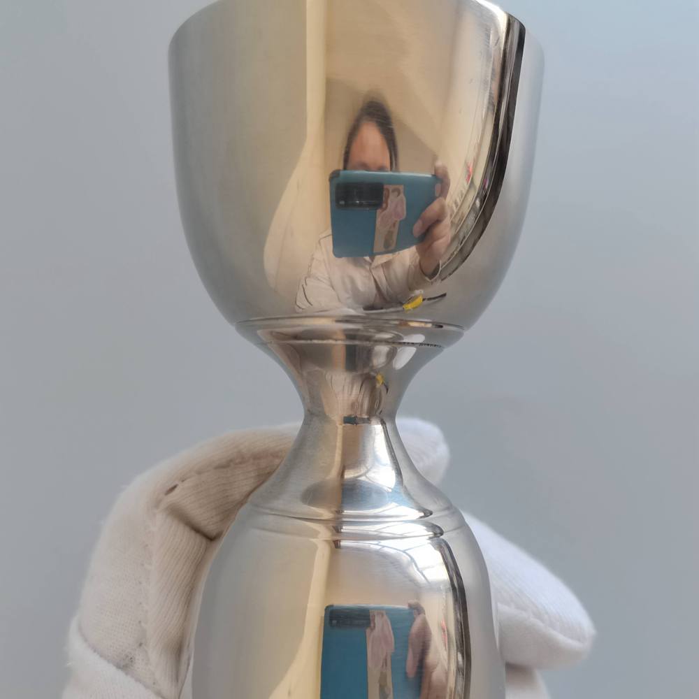 LARBO stainless steel Japanese jigger bottom cone detail showing mirror polished finish